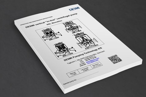 DESMI manual for vertical "in-line" centrifugal pump NSL Monobloc, on a table.