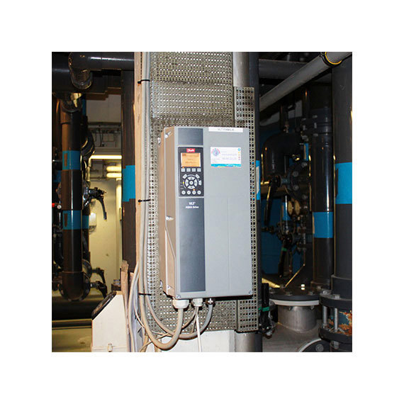 Industrial control panel with display and buttons, mounted on a metal frame.