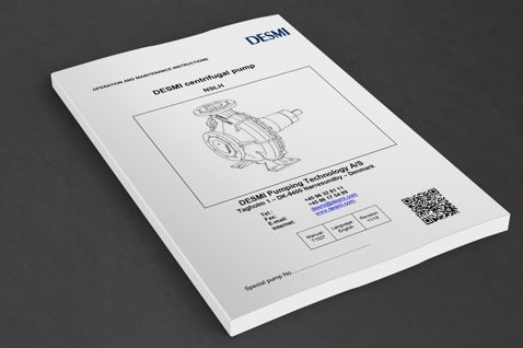 DESMI centrifugal pump NSLH manual on a table, includes contact information and QR code.