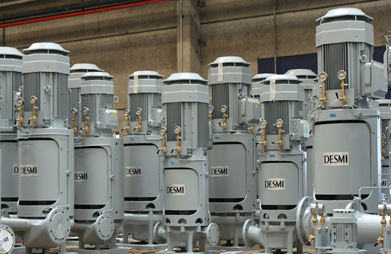 DESMI vertical centrifugal pumps on wooden pallets in an industrial setting.