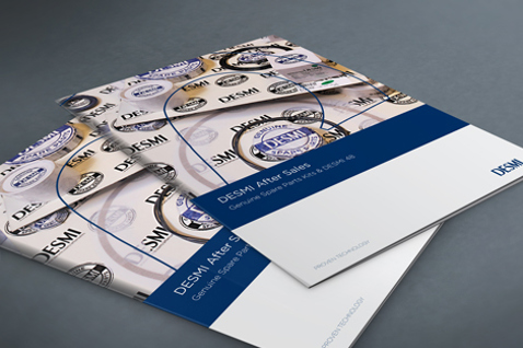 DESMI After Sales brochures with company logo on a gray surface.