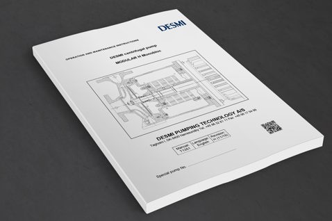 Manual for DESMI centrifugal pump, MODULAR H Monobloc, on a dark surface.