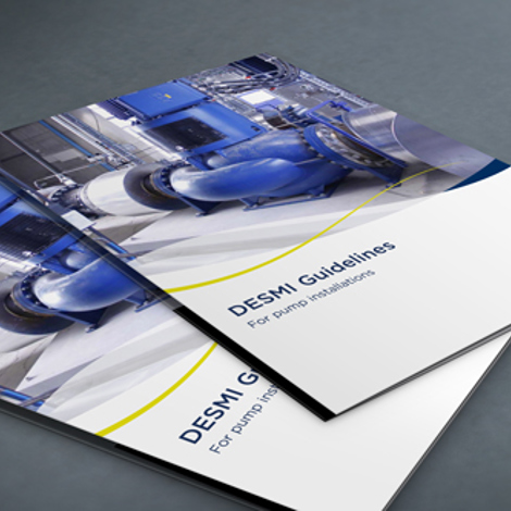 DESMI guidelines booklet for pump installations, featuring blue industrial pump imagery.