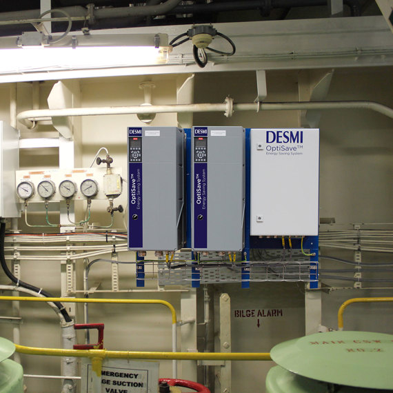 DESMI OptiSave energy-saving system with gauges and control panels for fluid handling.