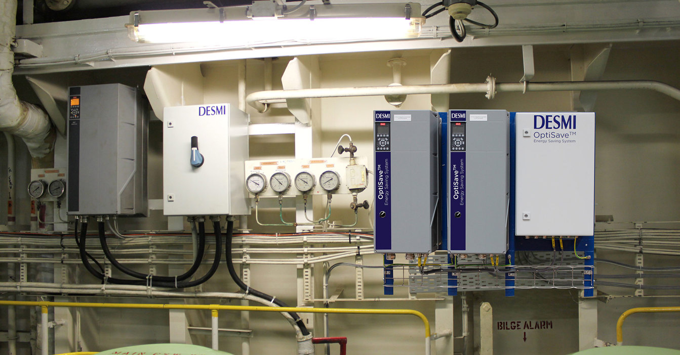 DESMI OptiSave energy-saving system with gauges and control panels for fluid handling.